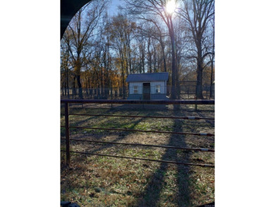 A RIVER RUNS THROUGH IT!!Located approx. 27 mi SE of Waldron on  in Arkansas - for sale on GolfHomes.com, golf home, golf lot