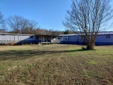 A RIVER RUNS THROUGH IT!!Located approx. 27 mi SE of Waldron on  in Arkansas - for sale on GolfHomes.com, golf home, golf lot