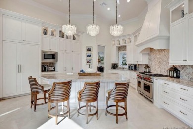 Experience the luxury and elegance of this Sailfish Point estate on Sailfish Point Golf Club, Inc. in Florida - for sale on GolfHomes.com, golf home, golf lot