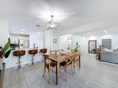 This beautifully renovated 2-bedroom, 2.5-bathroom townhouse on Woodmont Country Club in Florida - for sale on GolfHomes.com, golf home, golf lot