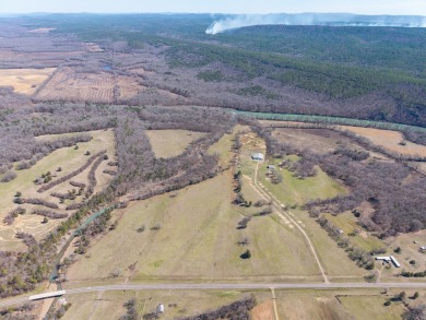 A RIVER RUNS THROUGH IT!!Located approx. 27 mi SE of Waldron on  in Arkansas - for sale on GolfHomes.com, golf home, golf lot