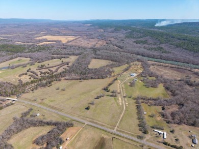 A RIVER RUNS THROUGH IT!!Located approx. 27 mi SE of Waldron on  in Arkansas - for sale on GolfHomes.com, golf home, golf lot