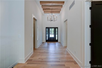 Stunning New Construction Reverse 1.5 Story Modern Farmhouse on The Club At Porto Cima in Missouri - for sale on GolfHomes.com, golf home, golf lot
