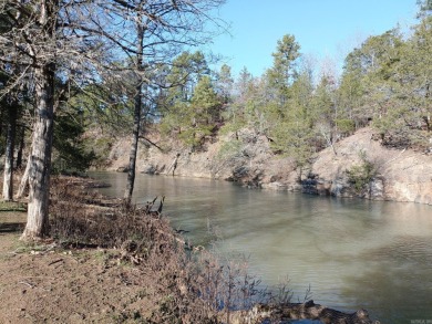 A RIVER RUNS THROUGH IT!!Located approx. 27 mi SE of Waldron on  in Arkansas - for sale on GolfHomes.com, golf home, golf lot