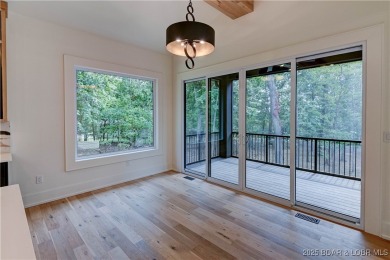 Stunning New Construction Reverse 1.5 Story Modern Farmhouse on The Club At Porto Cima in Missouri - for sale on GolfHomes.com, golf home, golf lot
