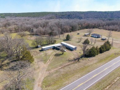 A RIVER RUNS THROUGH IT!!Located approx. 27 mi SE of Waldron on  in Arkansas - for sale on GolfHomes.com, golf home, golf lot