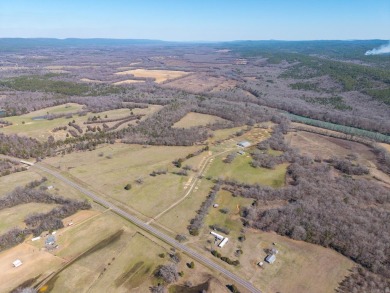 A RIVER RUNS THROUGH IT!!Located approx. 27 mi SE of Waldron on  in Arkansas - for sale on GolfHomes.com, golf home, golf lot