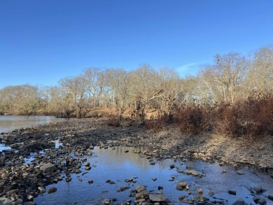 A RIVER RUNS THROUGH IT!!Located approx. 27 mi SE of Waldron on  in Arkansas - for sale on GolfHomes.com, golf home, golf lot