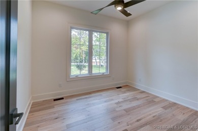 Stunning New Construction Reverse 1.5 Story Modern Farmhouse on The Club At Porto Cima in Missouri - for sale on GolfHomes.com, golf home, golf lot