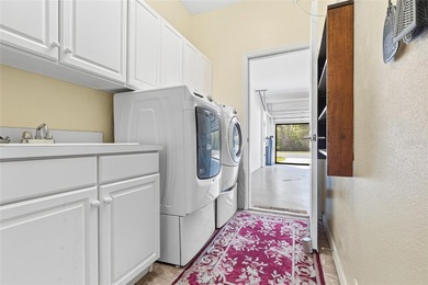 PRIVACY ON CONSERVATION THIS 3 BED/2BATH/2 CAR GARAGE *WITH GOLF on The Groves Golf and Country Club in Florida - for sale on GolfHomes.com, golf home, golf lot