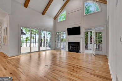 LAKEFRONT LIVING with over 180' of Lake Kedron views and on Canongate At Flat Creek Club in Georgia - for sale on GolfHomes.com, golf home, golf lot
