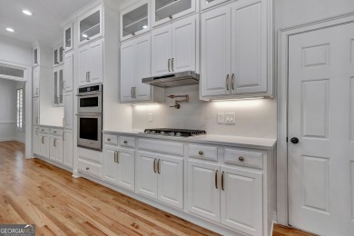 LAKEFRONT LIVING with over 180' of Lake Kedron views and on Canongate At Flat Creek Club in Georgia - for sale on GolfHomes.com, golf home, golf lot