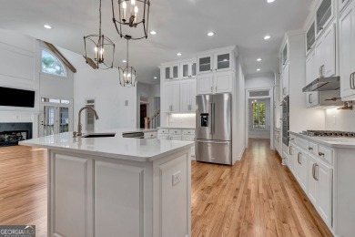 LAKEFRONT LIVING with over 180' of Lake Kedron views and on Canongate At Flat Creek Club in Georgia - for sale on GolfHomes.com, golf home, golf lot