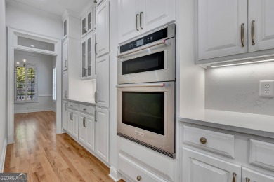 LAKEFRONT LIVING with over 180' of Lake Kedron views and on Canongate At Flat Creek Club in Georgia - for sale on GolfHomes.com, golf home, golf lot