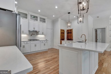 LAKEFRONT LIVING with over 180' of Lake Kedron views and on Canongate At Flat Creek Club in Georgia - for sale on GolfHomes.com, golf home, golf lot