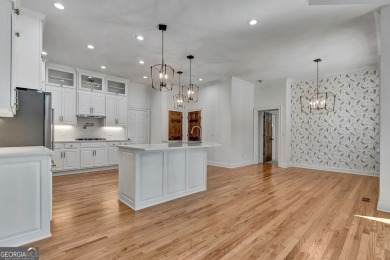 LAKEFRONT LIVING with over 180' of Lake Kedron views and on Canongate At Flat Creek Club in Georgia - for sale on GolfHomes.com, golf home, golf lot