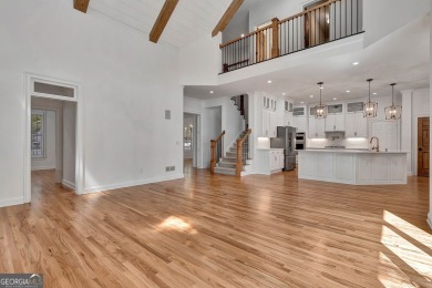 LAKEFRONT LIVING with over 180' of Lake Kedron views and on Canongate At Flat Creek Club in Georgia - for sale on GolfHomes.com, golf home, golf lot