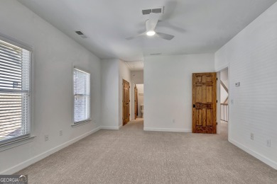 LAKEFRONT LIVING with over 180' of Lake Kedron views and on Canongate At Flat Creek Club in Georgia - for sale on GolfHomes.com, golf home, golf lot