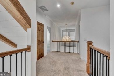 LAKEFRONT LIVING with over 180' of Lake Kedron views and on Canongate At Flat Creek Club in Georgia - for sale on GolfHomes.com, golf home, golf lot