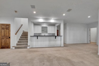 LAKEFRONT LIVING with over 180' of Lake Kedron views and on Canongate At Flat Creek Club in Georgia - for sale on GolfHomes.com, golf home, golf lot