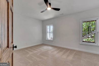 LAKEFRONT LIVING with over 180' of Lake Kedron views and on Canongate At Flat Creek Club in Georgia - for sale on GolfHomes.com, golf home, golf lot