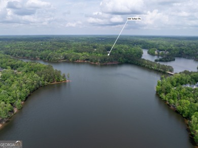 LAKEFRONT LIVING with over 180' of Lake Kedron views and on Canongate At Flat Creek Club in Georgia - for sale on GolfHomes.com, golf home, golf lot