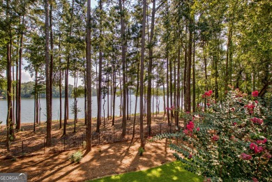 LAKEFRONT LIVING with over 180' of Lake Kedron views and on Canongate At Flat Creek Club in Georgia - for sale on GolfHomes.com, golf home, golf lot
