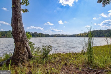 LAKEFRONT LIVING with over 180' of Lake Kedron views and on Canongate At Flat Creek Club in Georgia - for sale on GolfHomes.com, golf home, golf lot