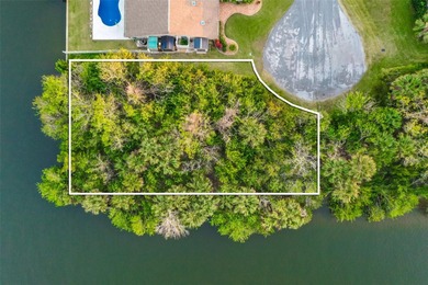 Ready to build on waterfront 0.30 acre lot featuring a fully on Palm Harbor Golf Club in Florida - for sale on GolfHomes.com, golf home, golf lot