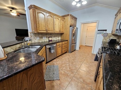 Beautiful 4-bed, 2-bath home just steps from the Andrews County on Andrews County Golf Course in Texas - for sale on GolfHomes.com, golf home, golf lot