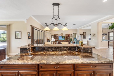 This exceptional waterfront pool home located in the on Sun n Lake Golf and Country Club in Florida - for sale on GolfHomes.com, golf home, golf lot