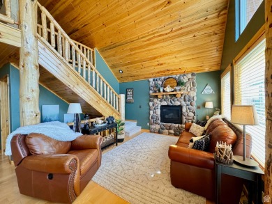 This charming cabin is nestled in a cul-de-sac with beautiful on Bear Lake West Golf and Country Club in Idaho - for sale on GolfHomes.com, golf home, golf lot