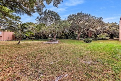 Spectacular 3/2.5 Townhome in prestigious community Pine Island on Pine Island Ridge Country Club in Florida - for sale on GolfHomes.com, golf home, golf lot