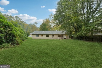 This renovated 3-bedroom, 2-bathroom home offers modern living on Mystery Valley Golf Course in Georgia - for sale on GolfHomes.com, golf home, golf lot