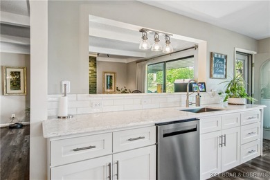 The location at Water's Edge everyone wants. A walk in unit with on Seasons Ridge At Four Seasons in Missouri - for sale on GolfHomes.com, golf home, golf lot