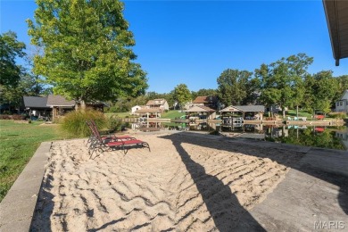 Stunning Waterfront Atrium Ranch with 4 bedrooms, 3 full baths on Raintree Country Club in Missouri - for sale on GolfHomes.com, golf home, golf lot