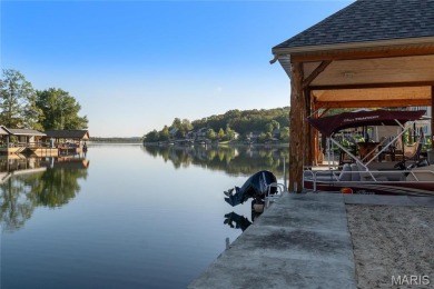 Stunning Waterfront Atrium Ranch with 4 bedrooms, 3 full baths on Raintree Country Club in Missouri - for sale on GolfHomes.com, golf home, golf lot