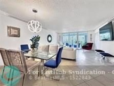 Discover your dream home in this bright and airy third-floor on Palm-Aire Country Club and Resort - Palms in Florida - for sale on GolfHomes.com, golf home, golf lot