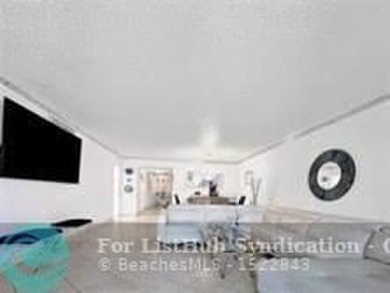 Discover your dream home in this bright and airy third-floor on Palm-Aire Country Club and Resort - Palms in Florida - for sale on GolfHomes.com, golf home, golf lot