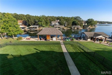 Stunning Waterfront Atrium Ranch with 4 bedrooms, 3 full baths on Raintree Country Club in Missouri - for sale on GolfHomes.com, golf home, golf lot