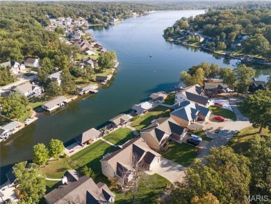 Stunning Waterfront Atrium Ranch with 4 bedrooms, 3 full baths on Raintree Country Club in Missouri - for sale on GolfHomes.com, golf home, golf lot