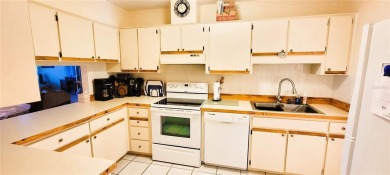 Pond View, spacious second floor furnished 2 bedroom, 2 bath on Tarpon Woods Golf Club in Florida - for sale on GolfHomes.com, golf home, golf lot