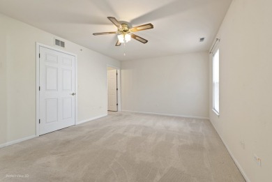 This lovely second floor condo in a secure building features 2 on The Links at Carillon in Illinois - for sale on GolfHomes.com, golf home, golf lot