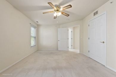 This lovely second floor condo in a secure building features 2 on The Links at Carillon in Illinois - for sale on GolfHomes.com, golf home, golf lot