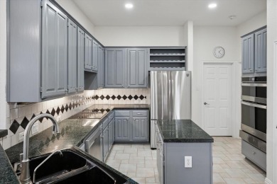 Situated on an oversized waterfront lot within the zero lot line on Hackberry Creek Country Club in Texas - for sale on GolfHomes.com, golf home, golf lot