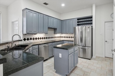 Situated on an oversized waterfront lot within the zero lot line on Hackberry Creek Country Club in Texas - for sale on GolfHomes.com, golf home, golf lot