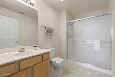 This lovely second floor condo in a secure building features 2 on The Links at Carillon in Illinois - for sale on GolfHomes.com, golf home, golf lot