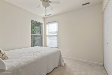 This lovely second floor condo in a secure building features 2 on The Links at Carillon in Illinois - for sale on GolfHomes.com, golf home, golf lot