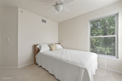 This lovely second floor condo in a secure building features 2 on The Links at Carillon in Illinois - for sale on GolfHomes.com, golf home, golf lot