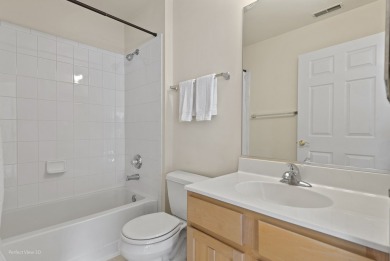This lovely second floor condo in a secure building features 2 on The Links at Carillon in Illinois - for sale on GolfHomes.com, golf home, golf lot
